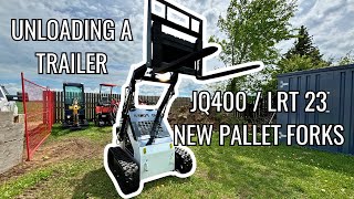 Mini Skid Steer Unloading Trailer  JQ400 New Pallet Forks [upl. by Aita]