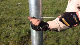 Tying wire to Strainer Post [upl. by Pacien]