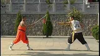 Shaolin Kung Fu weapons flail staff vs spear duet [upl. by Molloy]