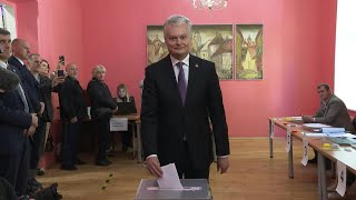 Lithuanian President Nauseda casts vote in presidential election  AFP [upl. by Swigart770]