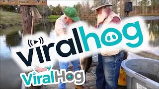 Record Bass Caught By Hand  ViralHog [upl. by Rehprotsirhc]