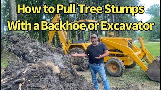 Using a Backhoe to Pull Tree Stumps [upl. by Aphra418]