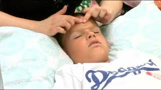 Massaging Nose of Child to Treat Sinus Congestion [upl. by Ellohcin]