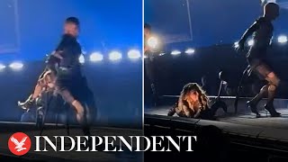 Madonna falls backwards off chair midsong during Seattle concert [upl. by Ecilef]