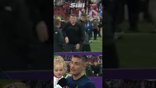 Moment jubilant young Airdrie footy fan dances the Macarena behind the manager [upl. by Akenaj505]