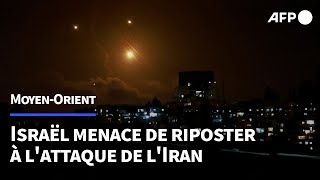 Israël tir de 200 missiles par lIran que Netanyahu menace de représailles  AFP [upl. by Irrep]