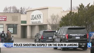 ‘Armed and dangerous’ police shooting suspect on the run in Lansing [upl. by Ailadgim]