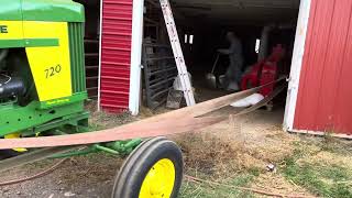 John Deere 720 running a belt driven hammer mill [upl. by Gilbye]