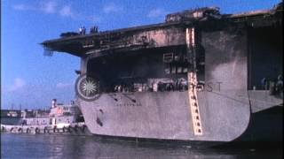 Damaged USS Enterprise arrives at Pearl Harbor in Hawaii following massive fire HD Stock Footage [upl. by Rikki180]