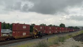 CPKC intermodal train and rail excavator in Cochrane Alberta [upl. by Mauchi]