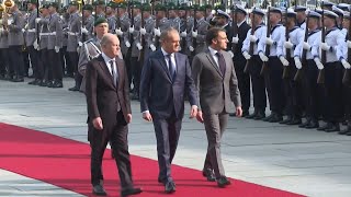 Scholz Macron and Tusk in Berlin for Ukraine talks  AFP [upl. by Aneehsram]