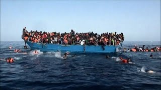 I migranti finiscono in mare il video del drammatico salvataggio [upl. by Artekal]